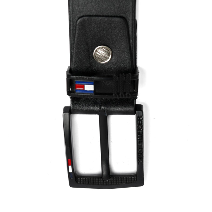 Black belt with a silver buckle on a white background